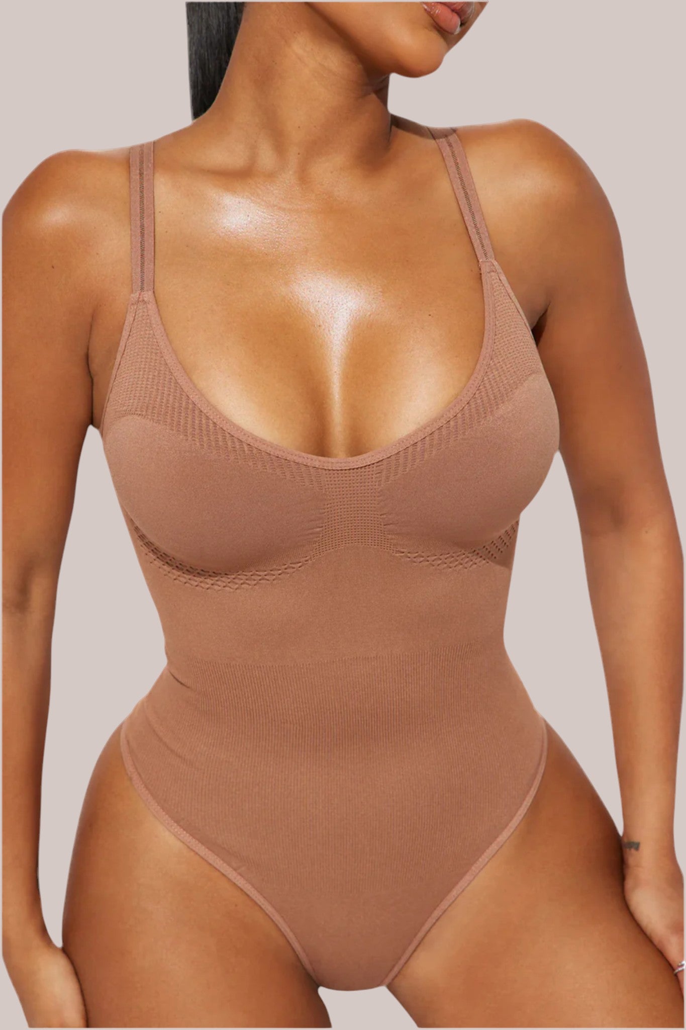Inshapewear™ beige seamless thong bodysuit with targeted compression for a smooth, sculpted silhouette.