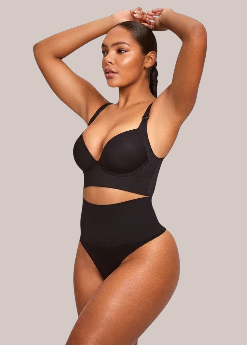 Model wearing Inshapewear™ black high-waisted shaping thong bodysuit with underwire bra top