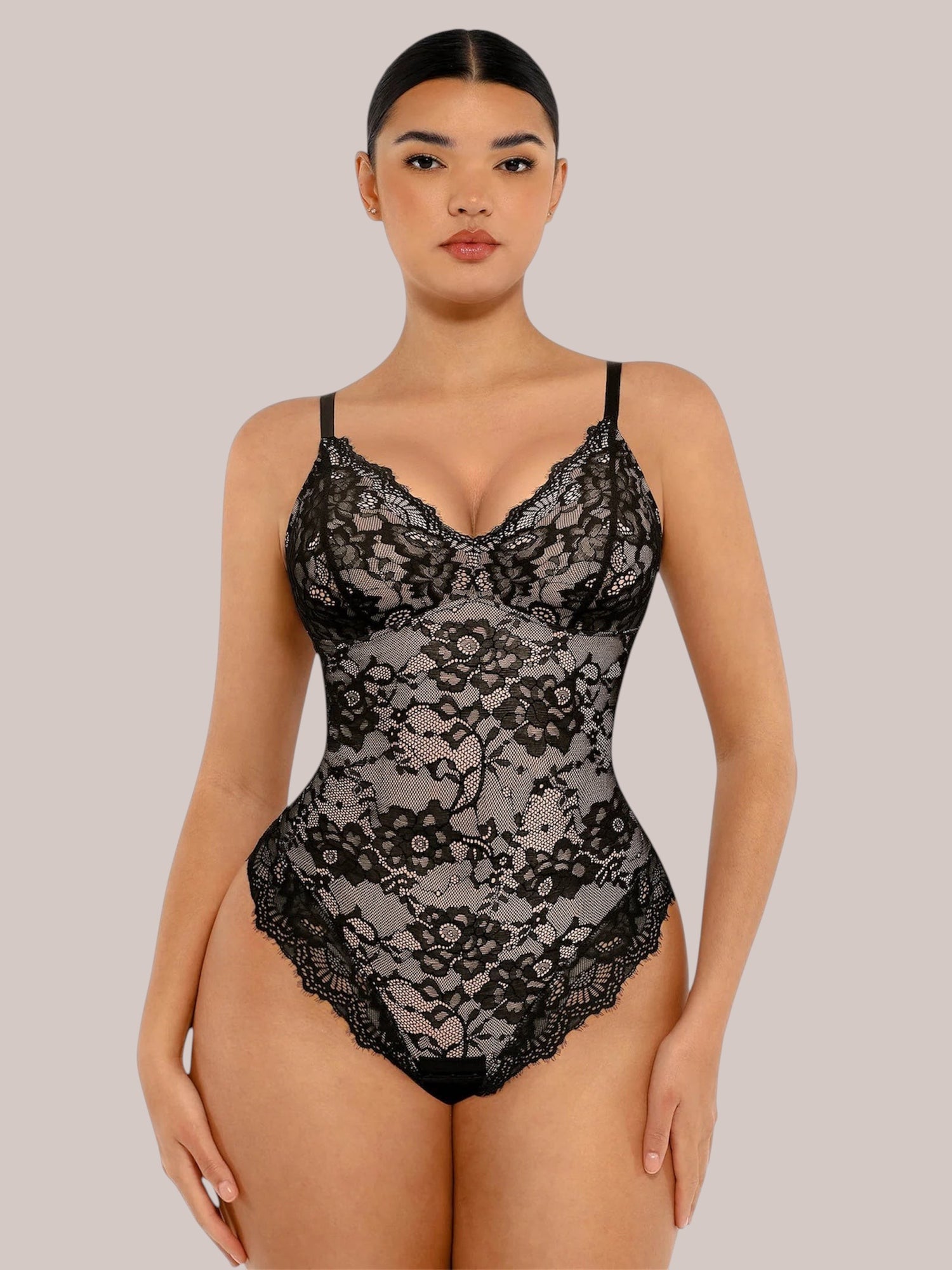 Inshapewear™ black lace bodysuit with a V-neckline and adjustable spaghetti straps on a model