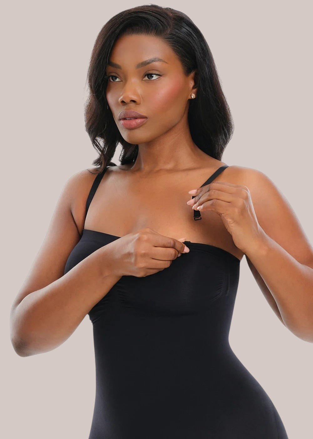 Model wearing Inshapewear™ black strapless shaping bodysuit with detachable straps for a smooth silhouette