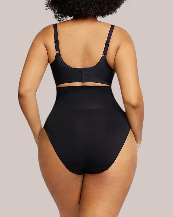 Back view of a model wearing Inshapewear™ high-waisted black shaping briefs with a supportive bra
