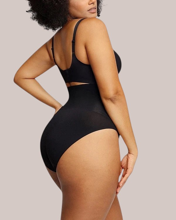 Model wearing Inshapewear™ high-waisted black shaping culottes for a smooth silhouette