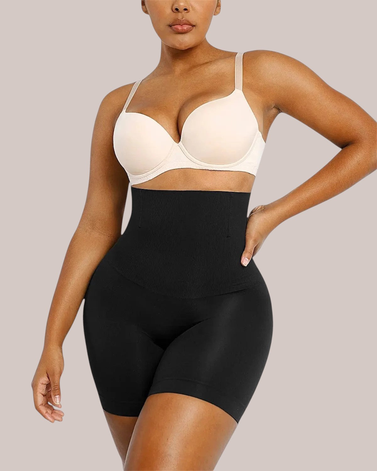 Inshapewear™ high-waisted black shaping shorts providing tummy control and a smooth silhouette on a model