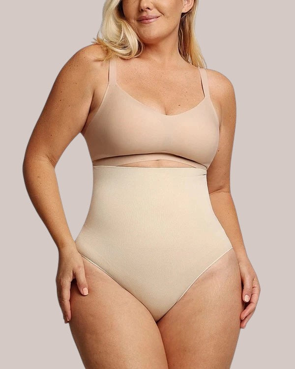 Model wearing beige Inshapewear™ high-waisted shaping culotte briefs for tummy control and smooth silhouette
